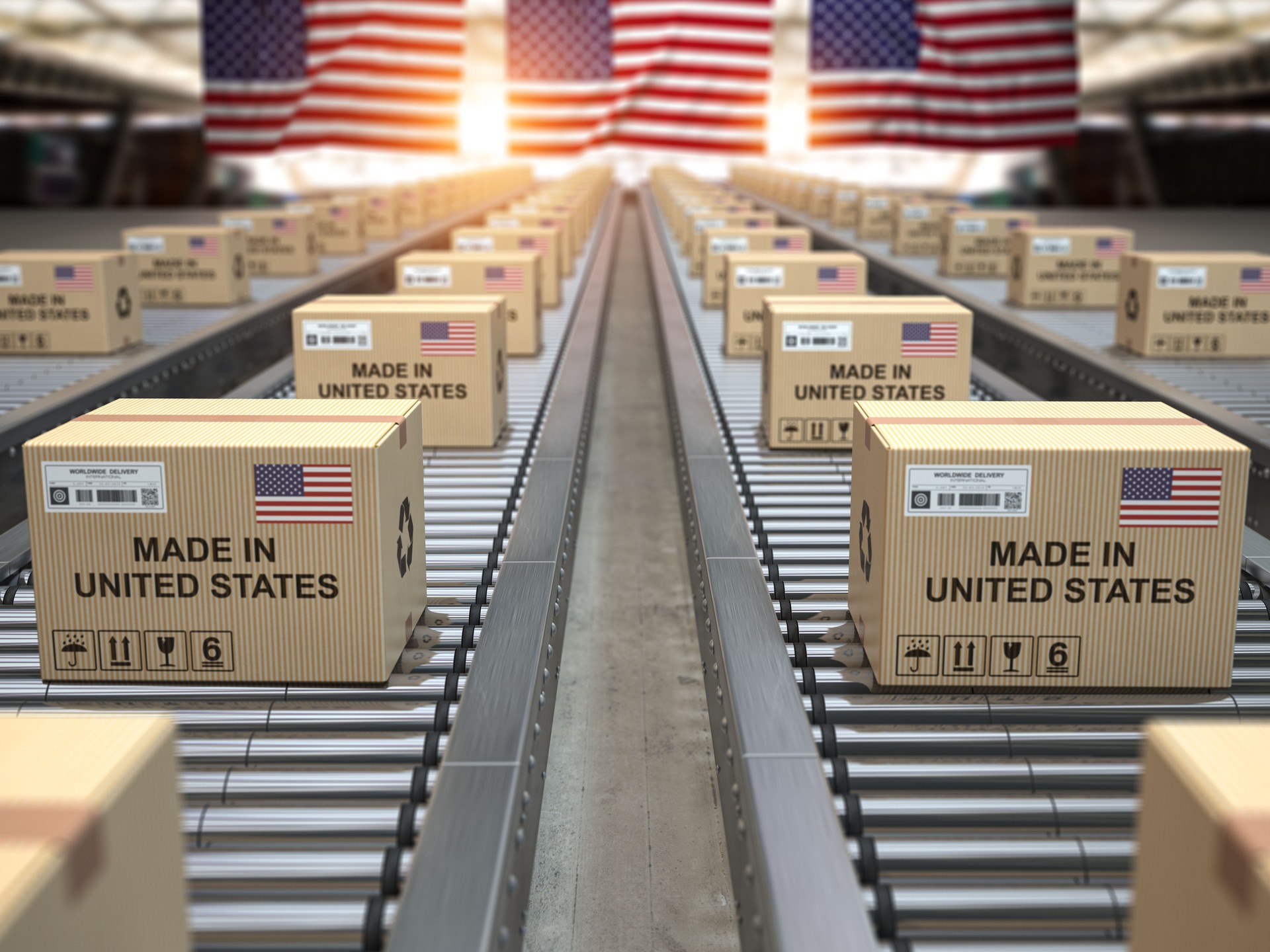 Made in USA United States. Cardboard boxes with text made in USA and american flag on the roller conveyor. Made in USA United States. Cardboard boxes with text made in USA and american flag on the roller conveyor.